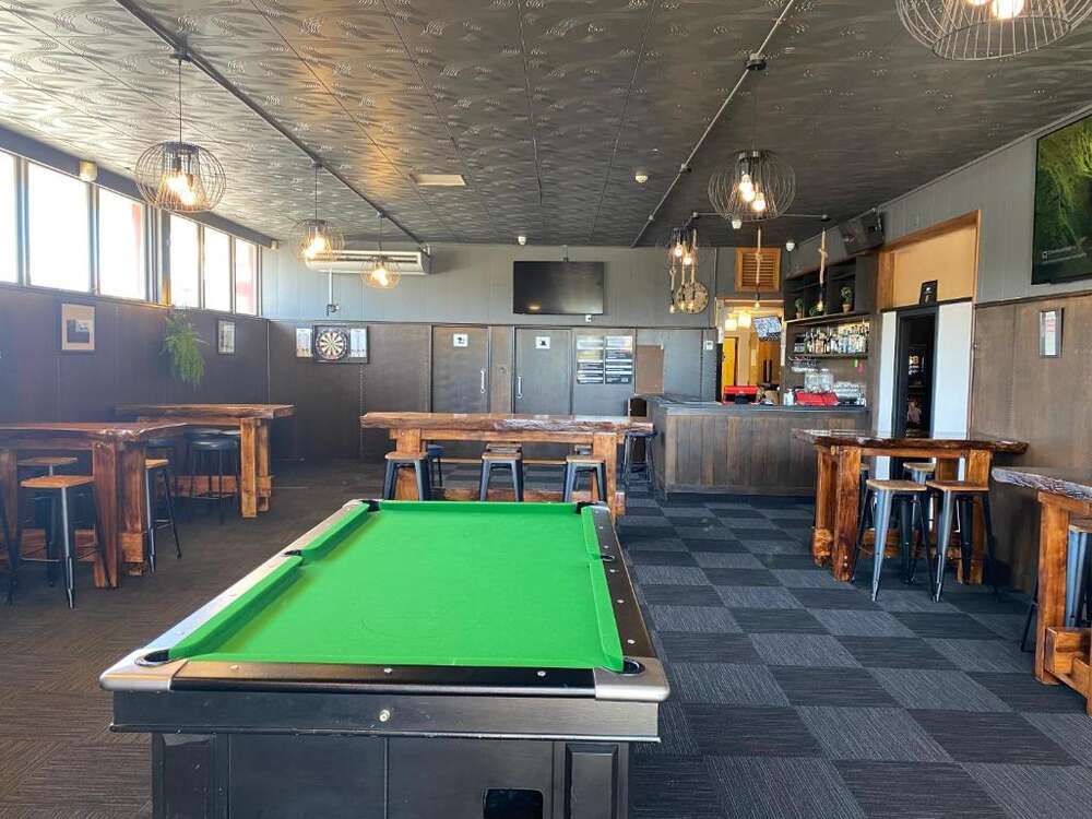 Sports bar with pool table, timber tables and bar at Masonic Hotel